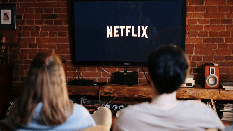 Will Netflix have ads?’ a couple watches nextflix on a couch